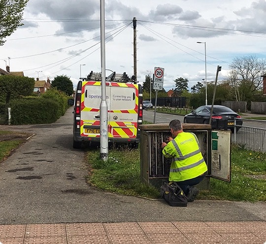 Openreach engineer working at a street cabinet